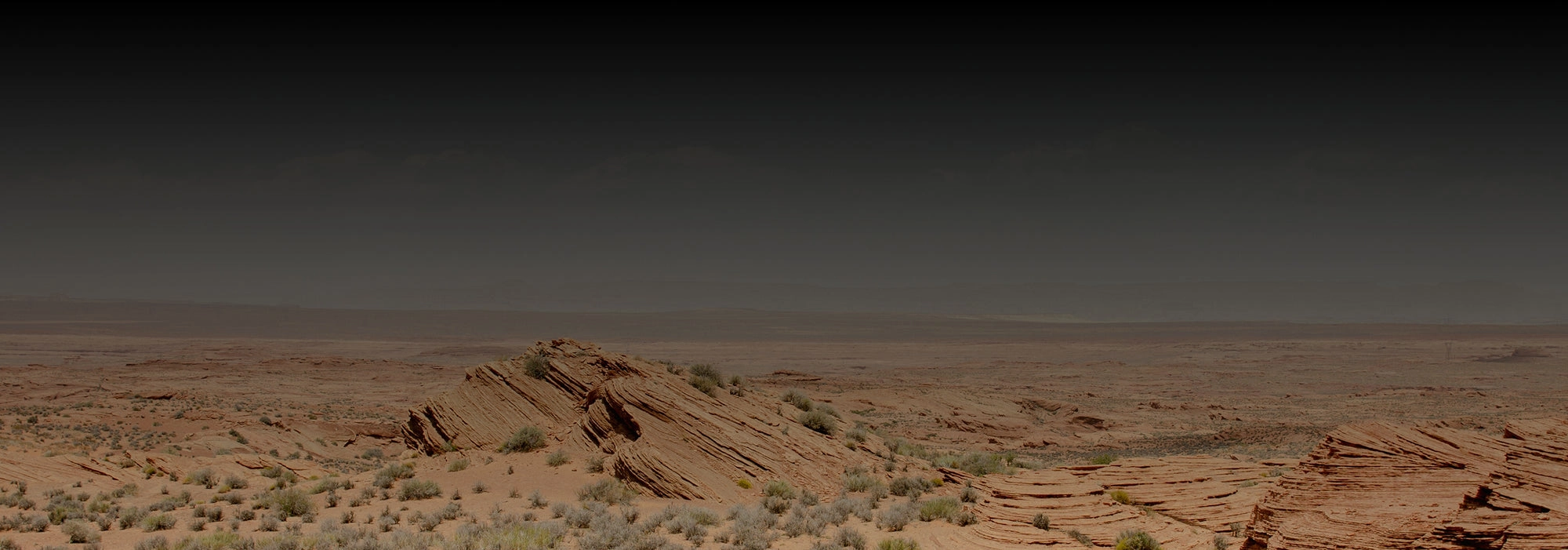 Dusk desert horizon with a dark sky