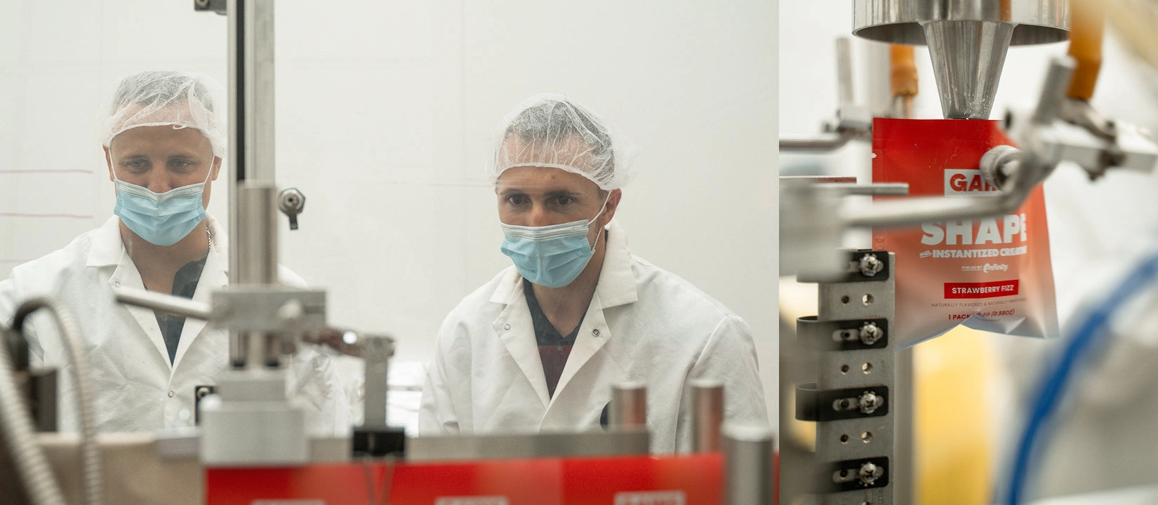 Two people in lab coats beside production equipment